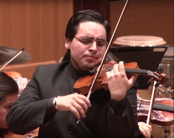 Violinist Frangel Lopez-Ceseña performing on stage